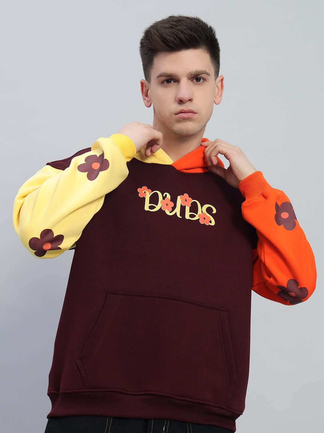 COSMOS oversized fleece hoodie in multi-color with floral sleeves and "Dubs" text, modeled against a neutral background.