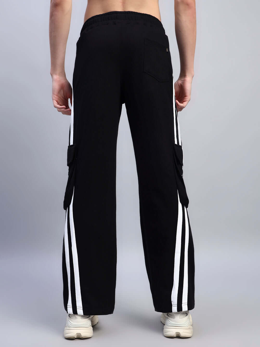 Back view of Crucis Multi Pocket Relaxed-Fit Joggers in black with two white stripes, showcasing comfortable design and multi-pocket features.