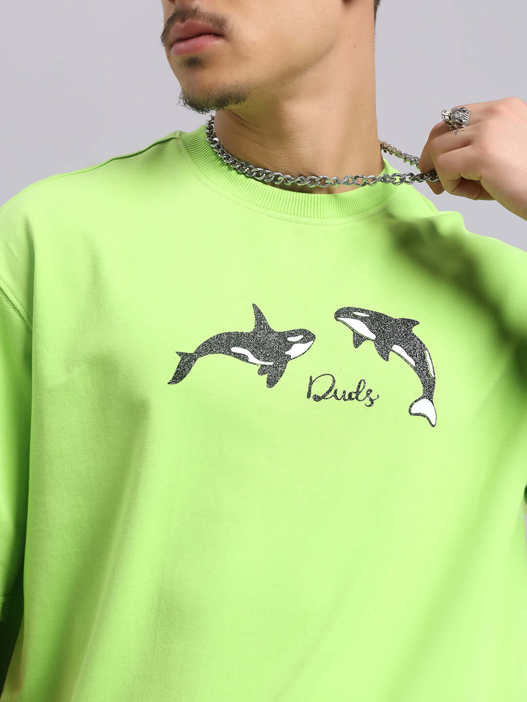 Neon green Orcas over-sized T-shirt featuring orca graphics, made from heavy gauge fabric with cotton and elastane. Proudly made in India.