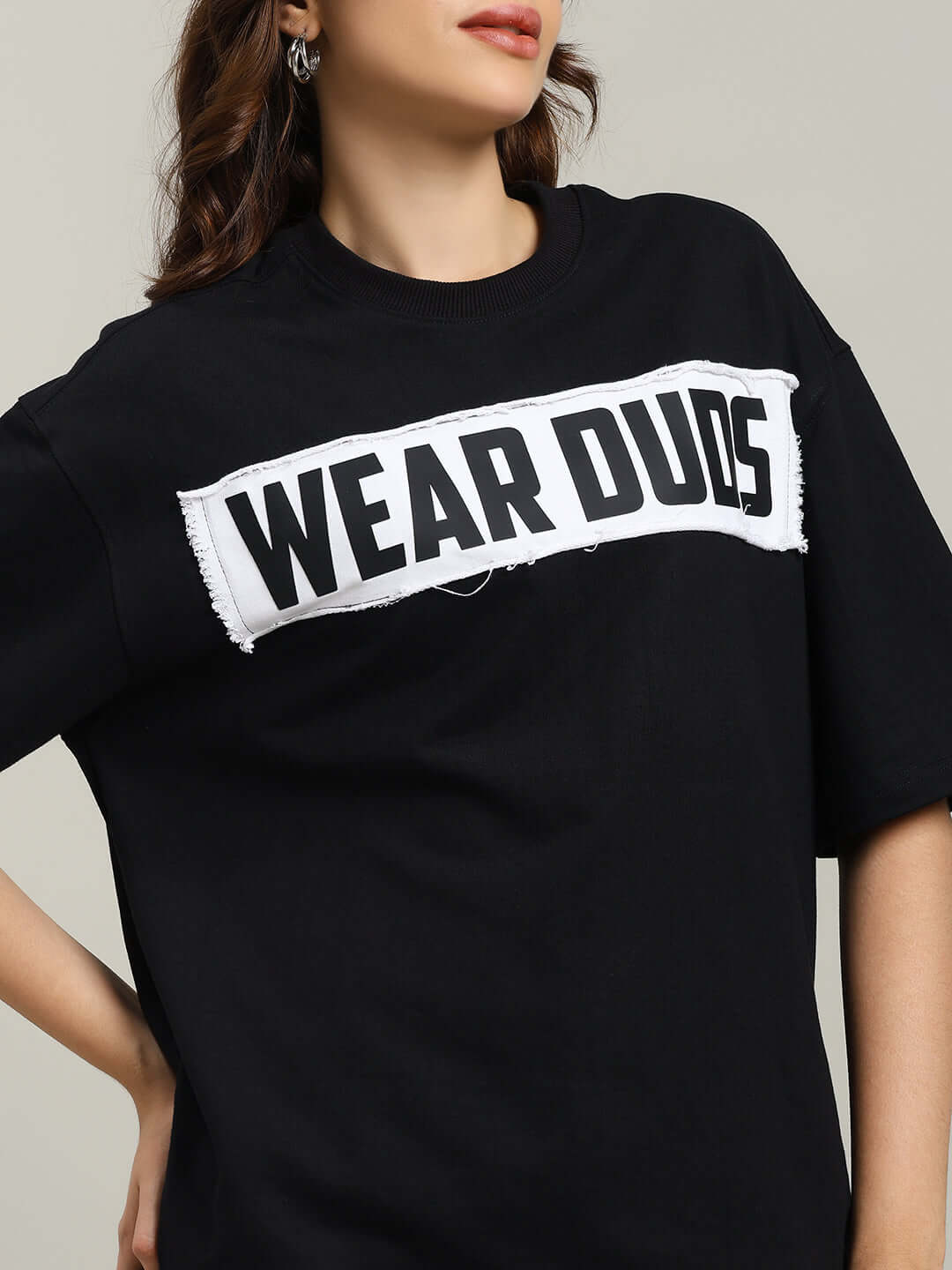 Women's oversized black Harley designer t-shirt featuring 'Wear Duds' text, crafted from premium cotton fabric.