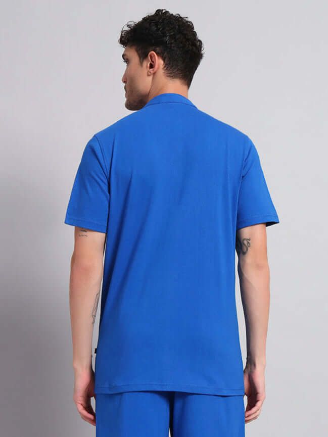 Back view of a model wearing a blue LIMBO Regular Fit Shirt made of premium cotton and elastane blend, ideal for casual occasions.