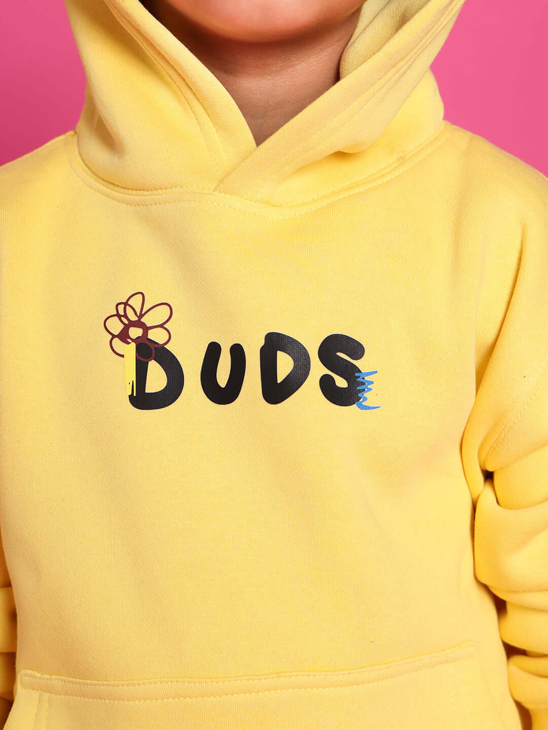 Child wearing a yellow "DUDS" hoodie, part of the Cool Dude Co-ord collection for boys and girls.