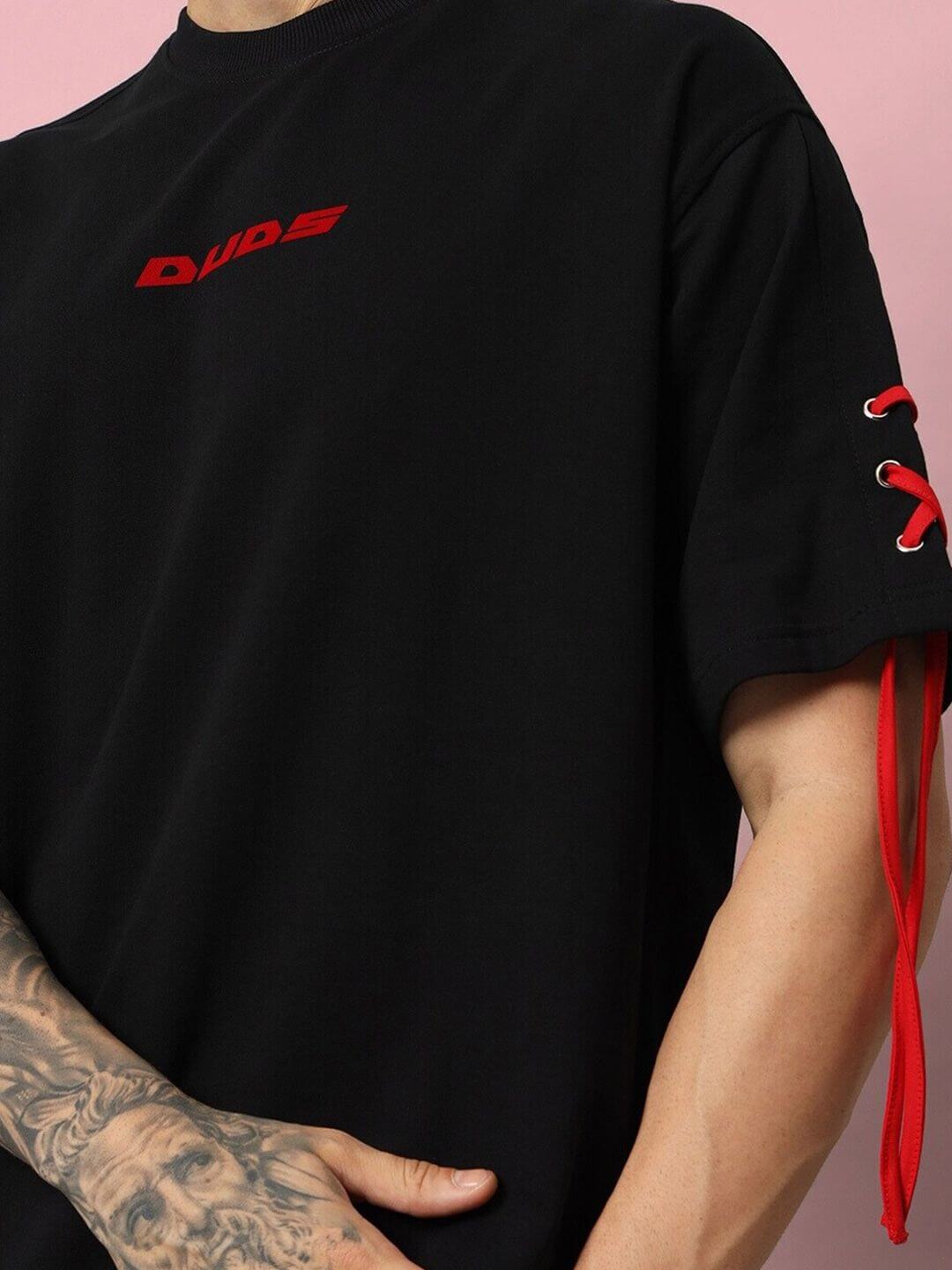 Bowline over-sized black T-shirt with red accents, made from premium heavy gauge fabric, featuring embroidered design and lace-up detail.