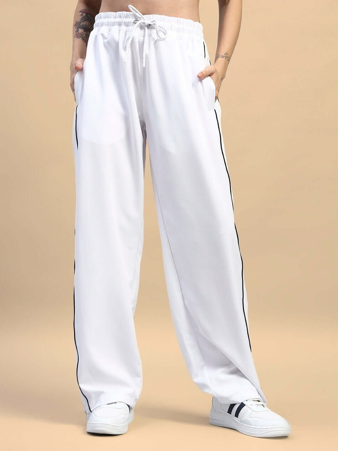 Women's relaxed-fit white joggers, featuring a drawstring waist and side pockets, perfect for comfortable loungewear.