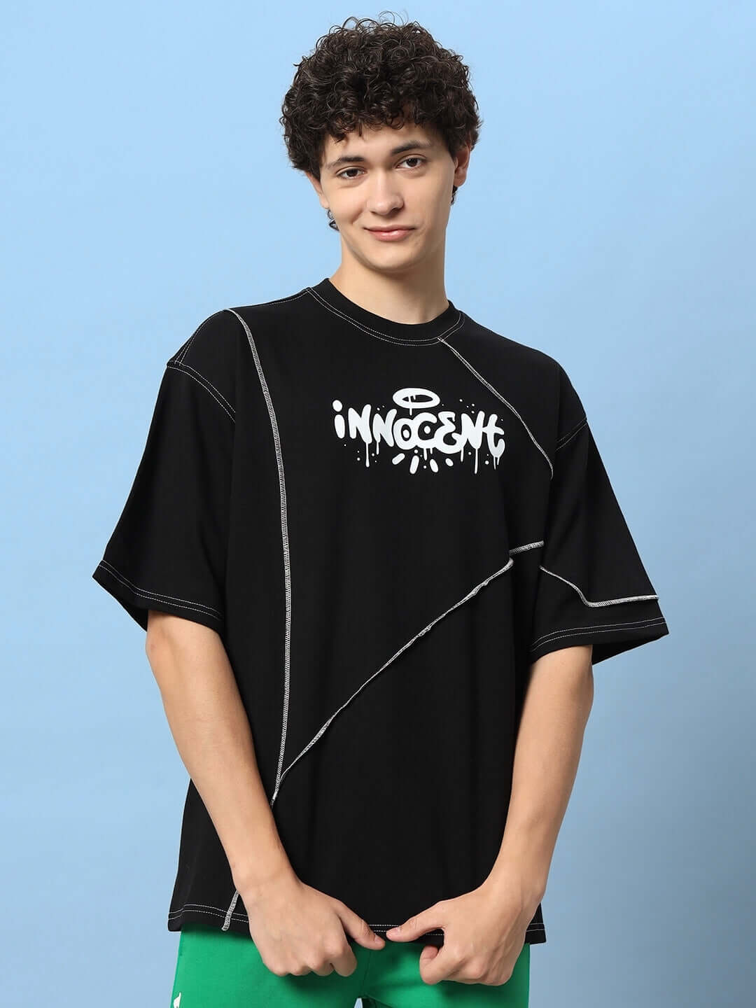 INNOCENT CONTRAST STITCHED OVER-SIZED T-SHIRT BLACK made from premium cotton fabric, featuring unique design and heavy gauge material.