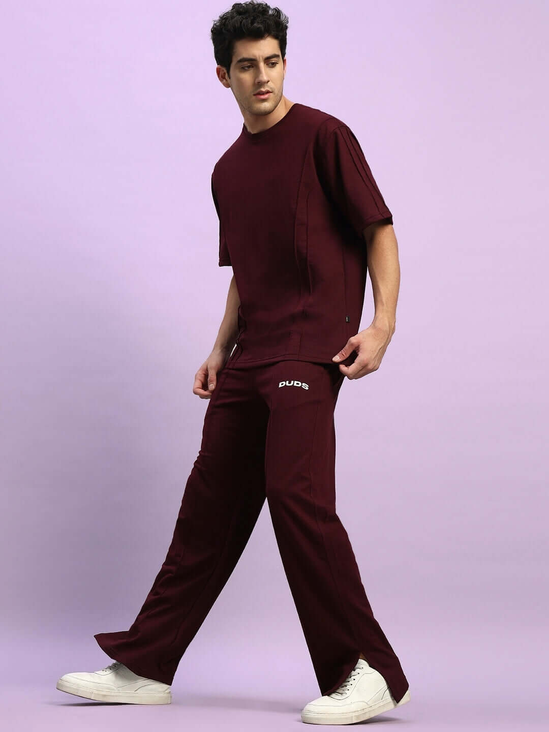 Model wearing ZION maroon relaxed fit co-ord set with joggers and T-shirt, featuring elasticated waistband and premium cotton fabric.
