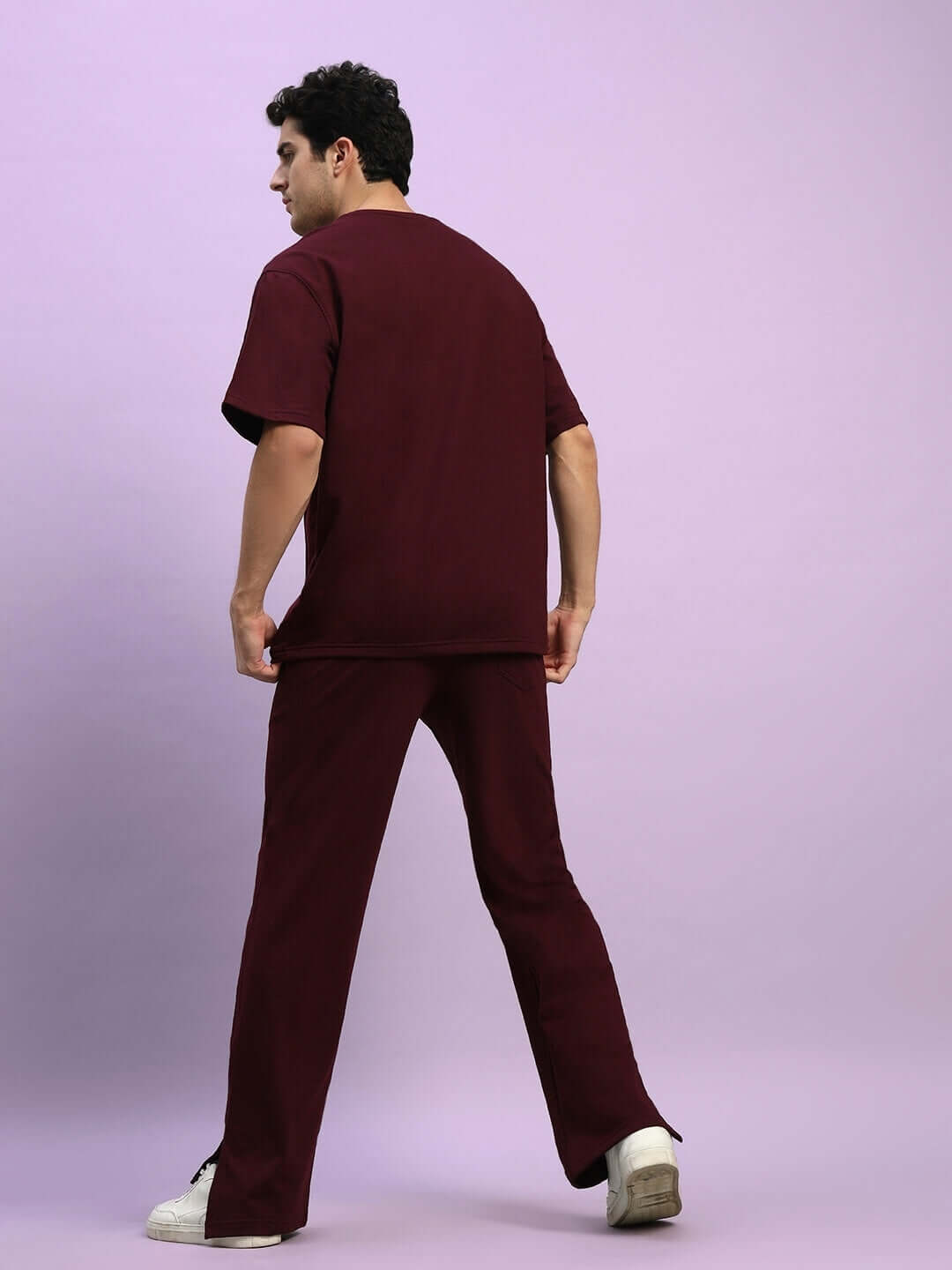 Person wearing ZION Relaxed Fit Co-Ord Set in maroon, featuring a t-shirt and joggers with elasticated waistband, perfect for casual comfort.