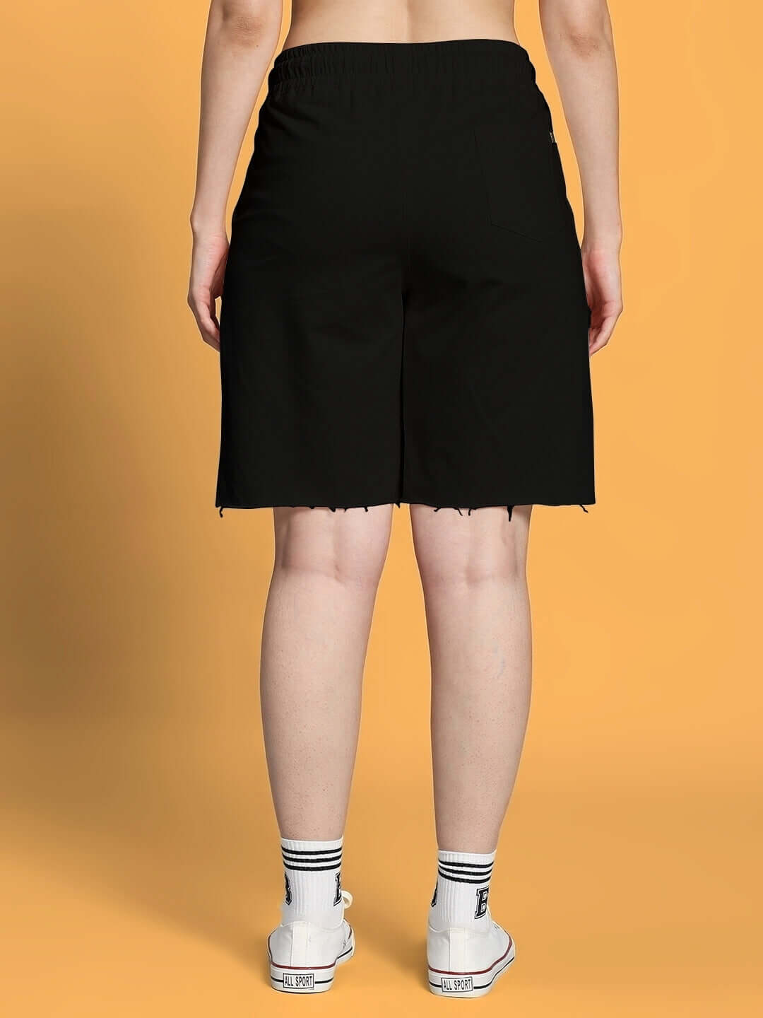 Back view of women's fancy regular fit black shorts, showcasing comfortable design and customizable fit options.