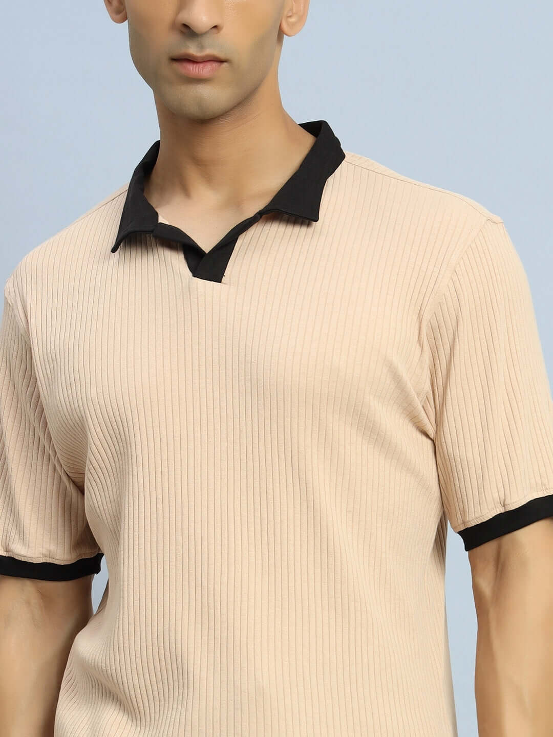 Model wearing FILIPINO REGULAR FIT T-SHIRT BEIGE with black collar and half sleeves, showcasing comfortable and stylish fit.
