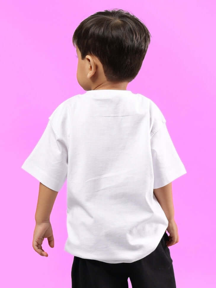 Boy wearing a white hedgehog t-shirt, perfect for kids, on a vibrant pink background.