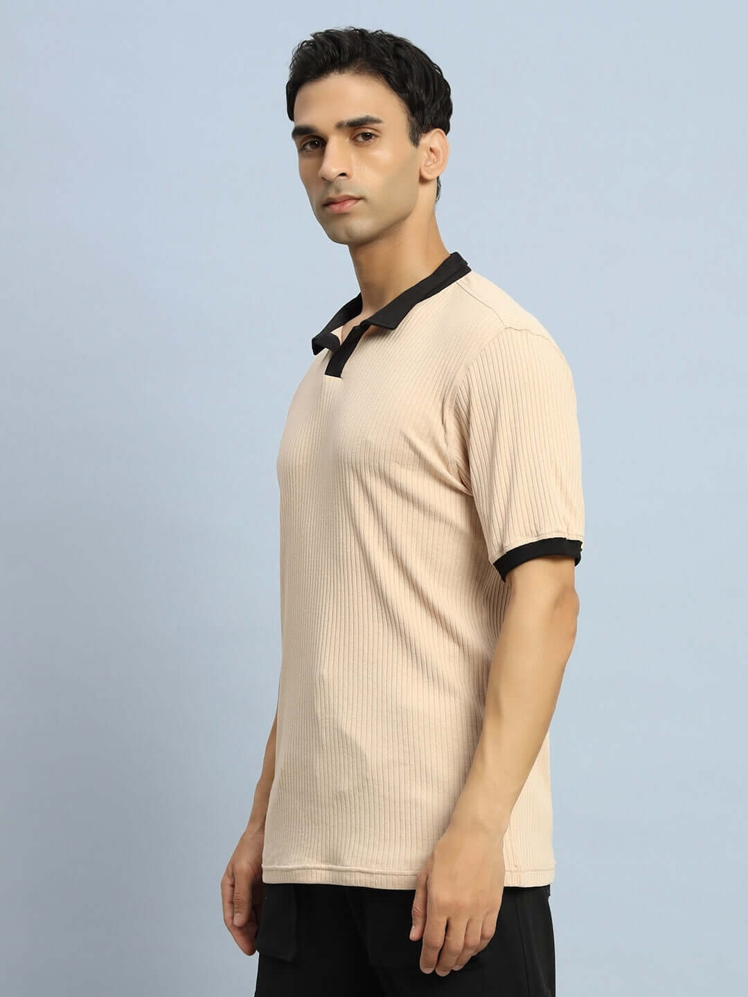Model wearing Filipino Regular Fit T-Shirt Beige with half sleeves and black collar, showcasing a casual look.