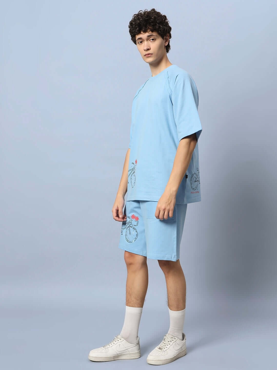 Model wearing ENJOY THE RIDE PRINTED CO-ORD SET BLUE, featuring premium cotton French terry lycra in a soft, relaxed fit.