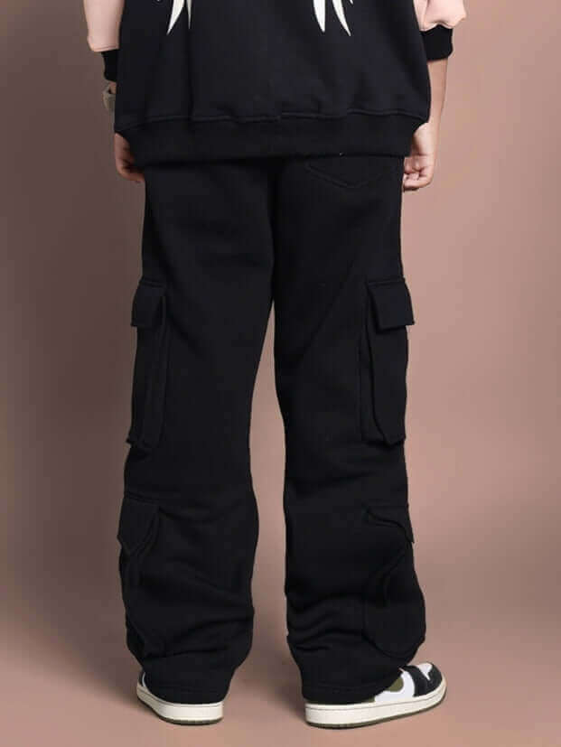 Back view of child wearing black cargo joggers with angel wing design, showcasing fleece texture and comfort for boys and girls.