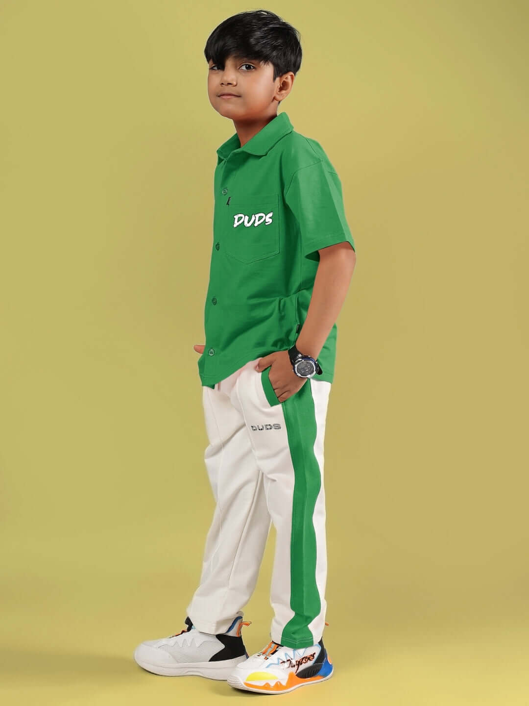 Child wearing green and off-white Angry Sponge Co-Ord set from DUDS, showcasing a trendy and comfortable style for kids.
