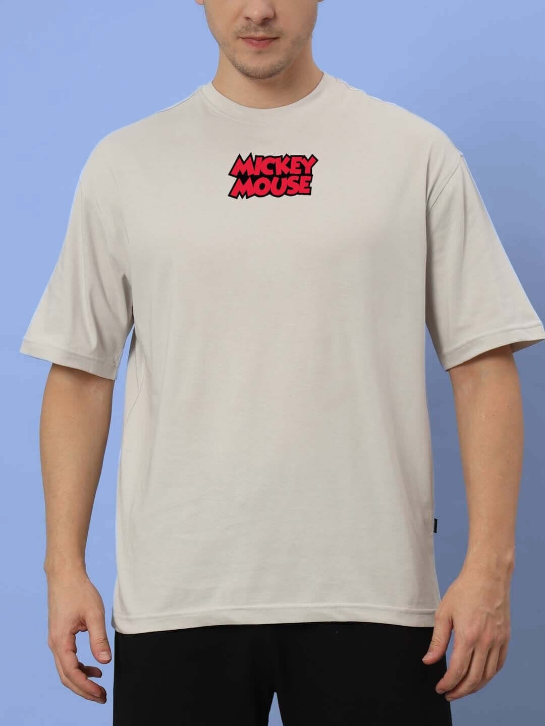 Man wearing DUDS MOUSE OVER-SIZED T-SHIRT GREY featuring Mickey Mouse logo.
