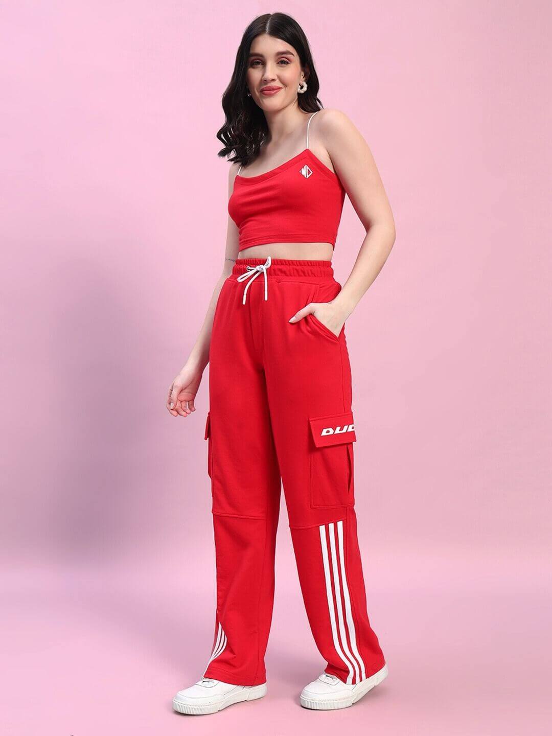 Woman wearing red Rosella co-ord set featuring a stylish crop top and cargo pants, crafted from premium cotton blend.