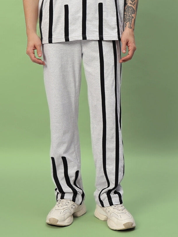 Model wearing Bastille Jogger in melange grey with black stripes, showcasing custom fit option by DUDS.