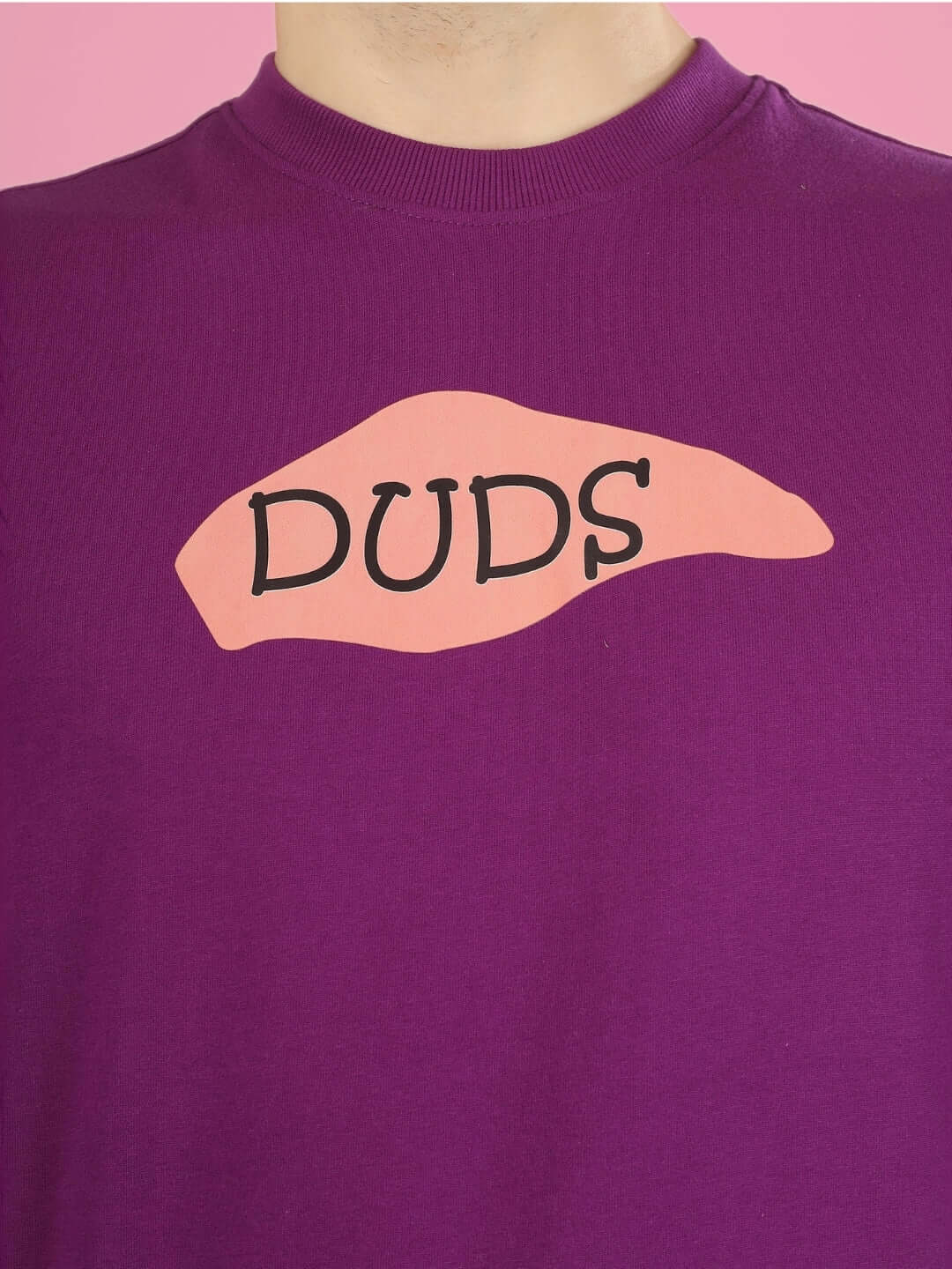 WHAT WOW OVER-SIZED PRINTED T-SHIRT PURPLE with "DUDS" logo detail in front view, customizable via DUDS Custom Fit option for prepaid orders.