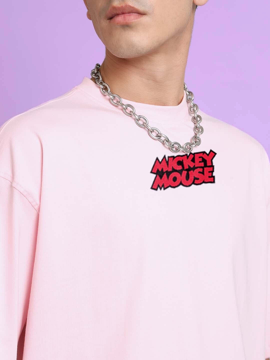 Person wearing DUDS MOUSE OVER-SIZED T-SHIRT PINK with a necklace.