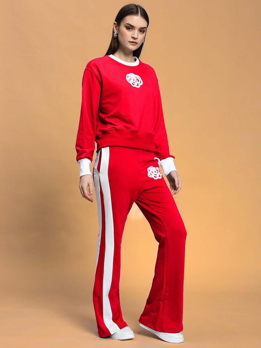 Woman wearing red Jessflick relaxed fit co-ord set with blue and white contrast panels, featuring elasticated waistband and drawstring.