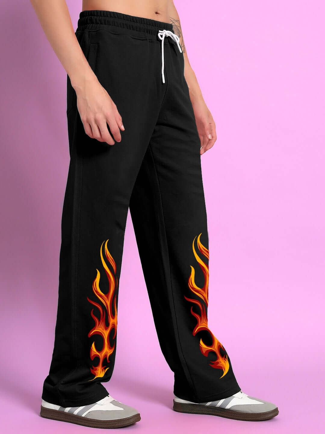 Model wearing Burning Fire Jogger in black with flame design, showcasing custom fit option by DUDS. Made-to-order apparel.