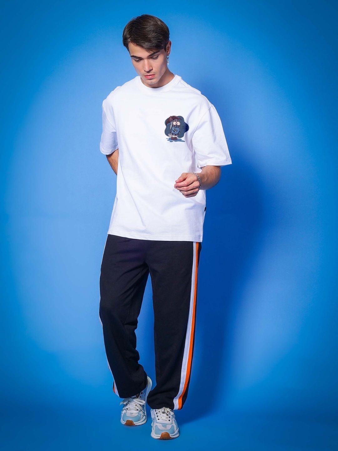 Model wearing BLUE LAPIN OVER-SIZED T-SHIRT WHITE with premium fabric, perfect for casual wear.