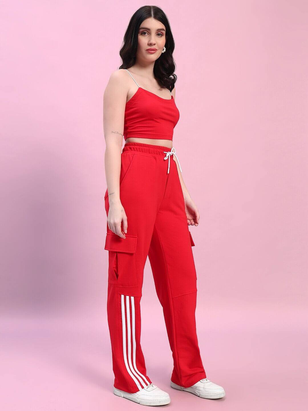 Model wearing Women's Rosella Co-ord Set in red, featuring a crop top and pants made from premium cotton and elastane blend.