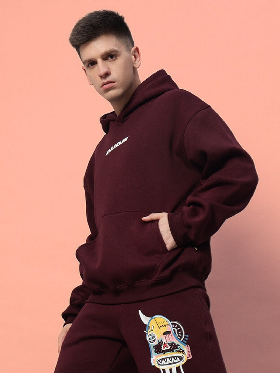 Jumbled premium wine colored hoodie fleece with graphic details. Perfect streetwear fashion choice for style and comfort.