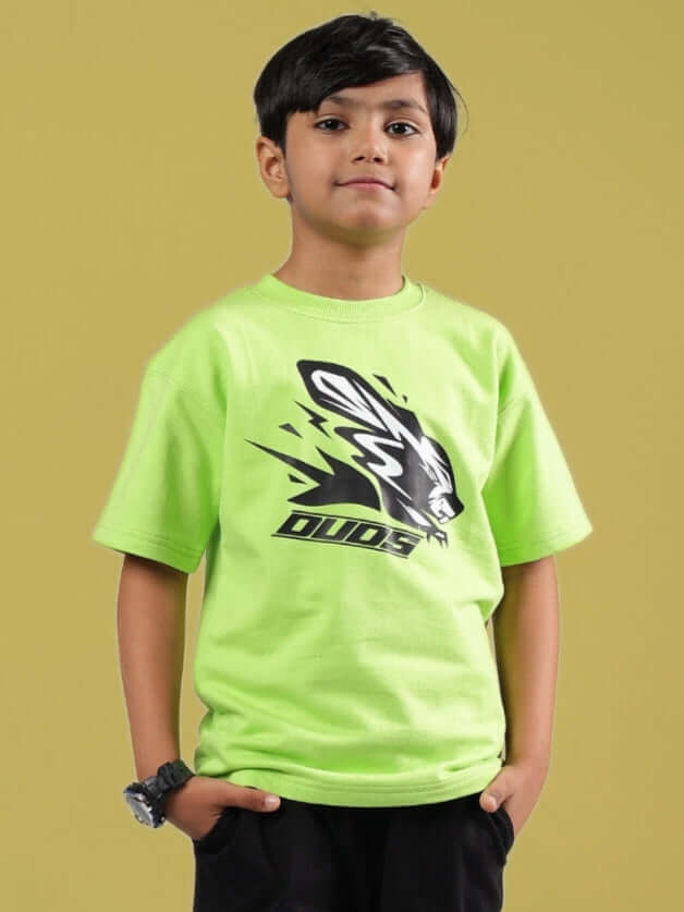 Child wearing neon green Muffin oversized T-shirt for boys & girls from DUDS, featuring bold graphic logo.