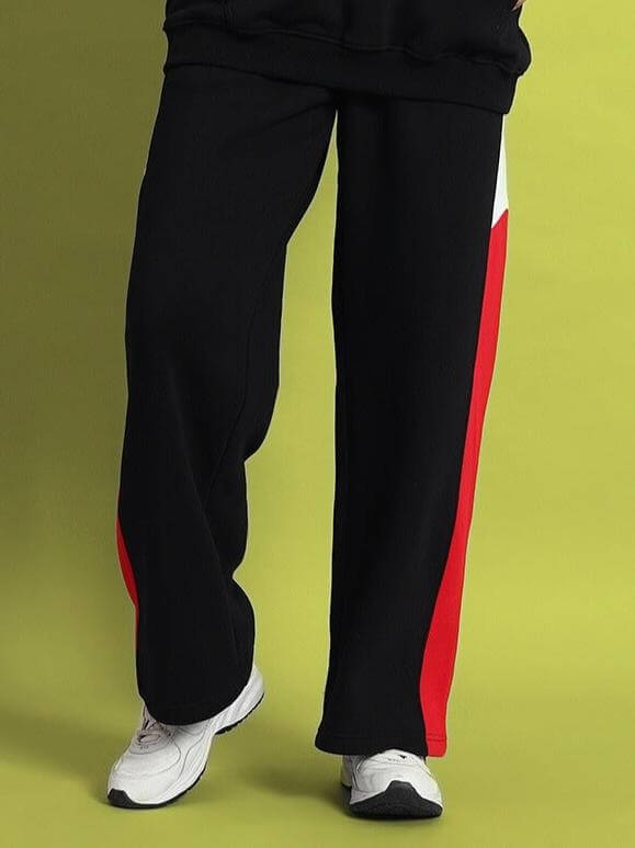 Women's WD Fervid Colorblock Cargo Pant in black with a striking red stripe, featuring a relaxed fit and utility pockets for bold streetwear style.