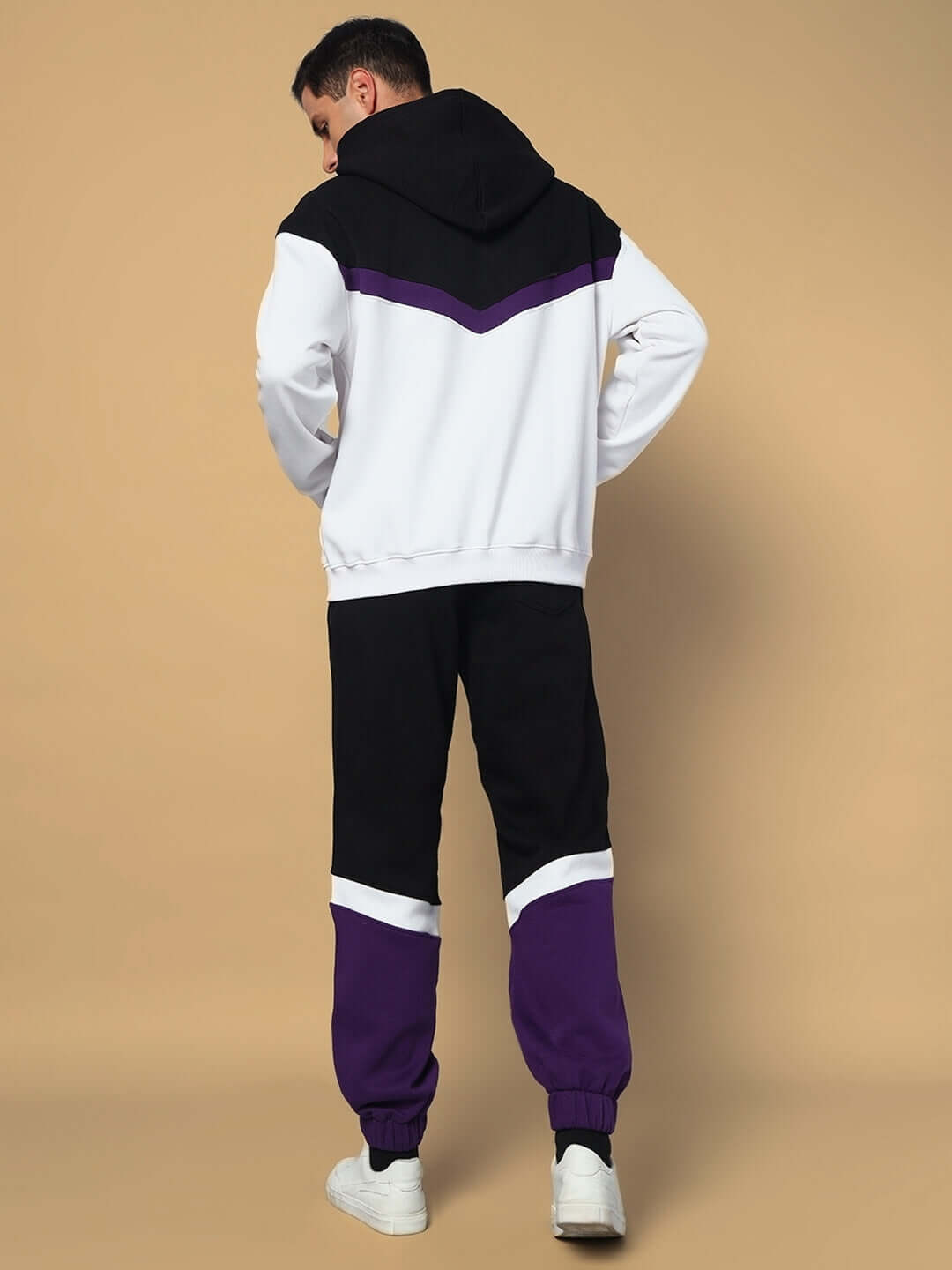 Back view of model wearing Harley Fleece Colorblock Jogger in purple, black, and white, showcasing stylish and comfortable design.