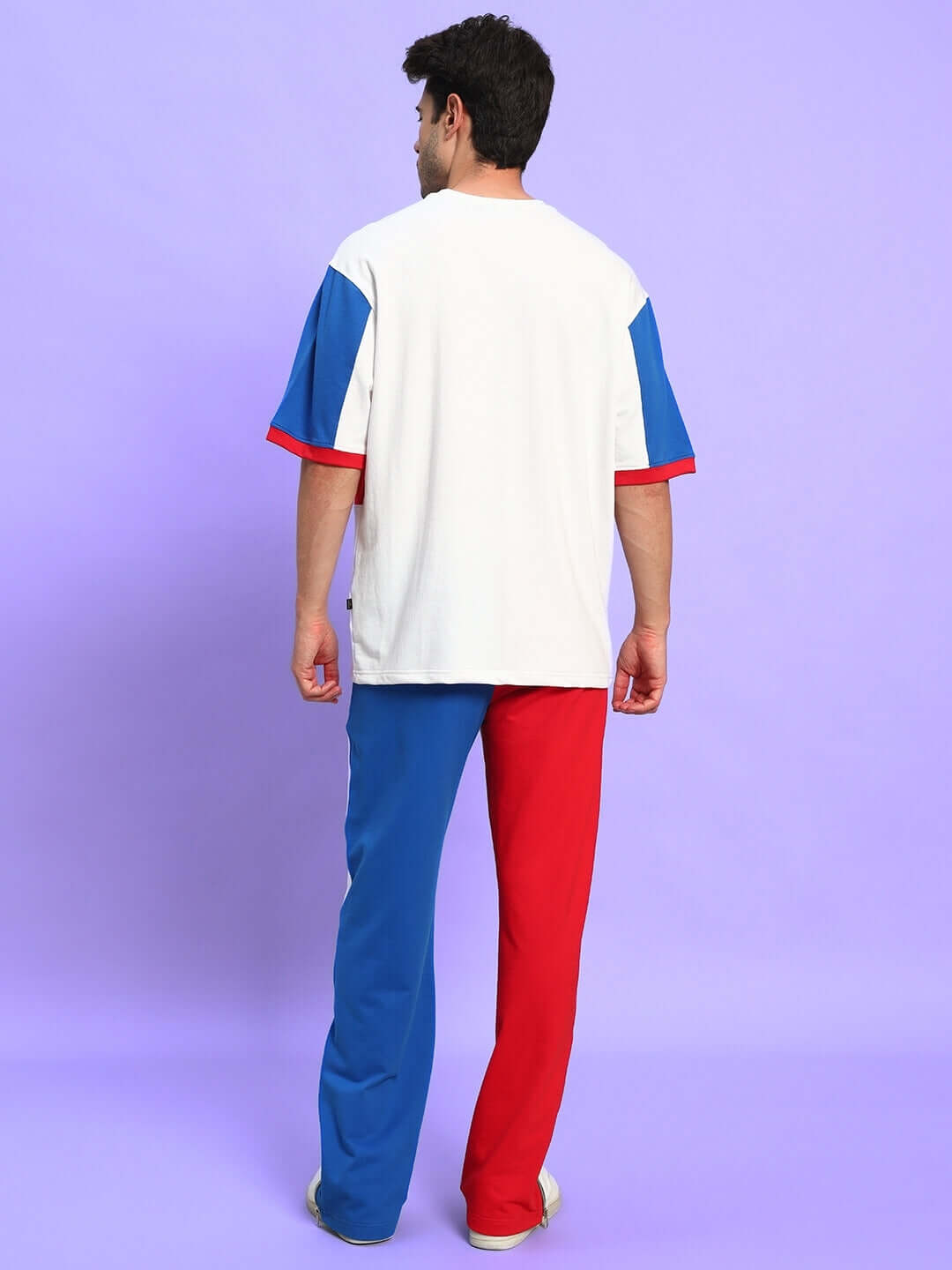 Back view of a man wearing the URBAN DRIFT relaxed fit co-ord set in a multi-color design, showcasing premium cotton fabric.