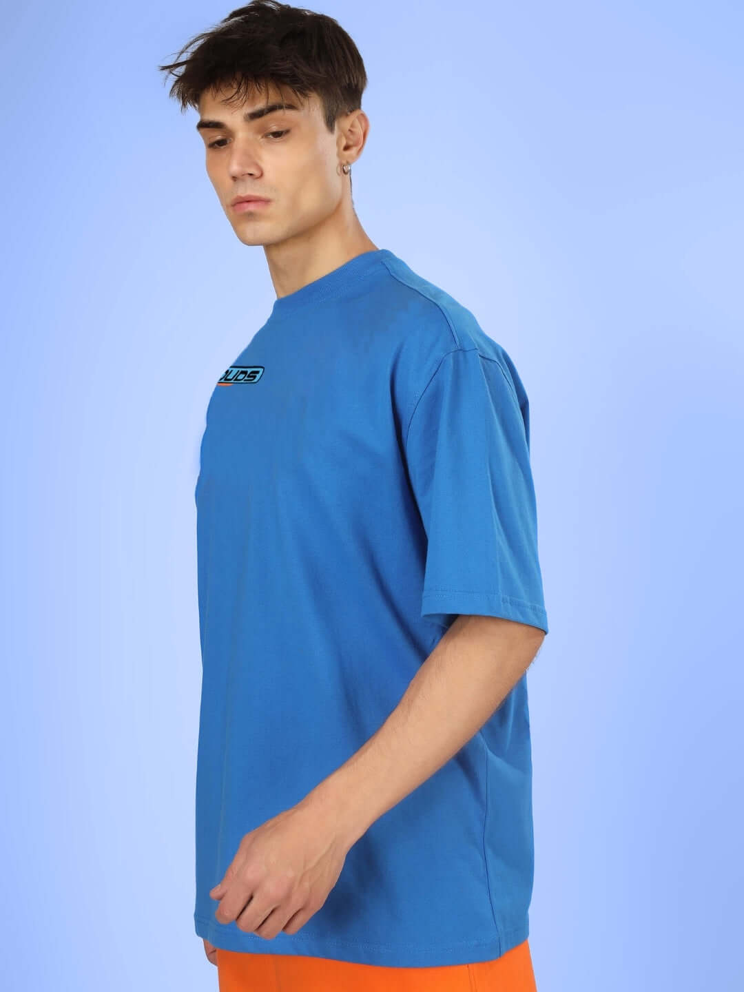 Model wearing ROBO SHARK OVER-SIZED T-SHIRT ROYAL BLUE with premium cotton fabric and elastane blend.
