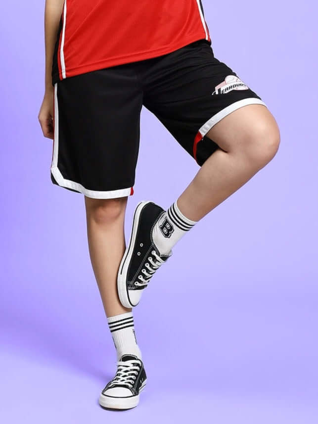 Women's black Portia regular fit shorts styled with sneakers and athletic socks.