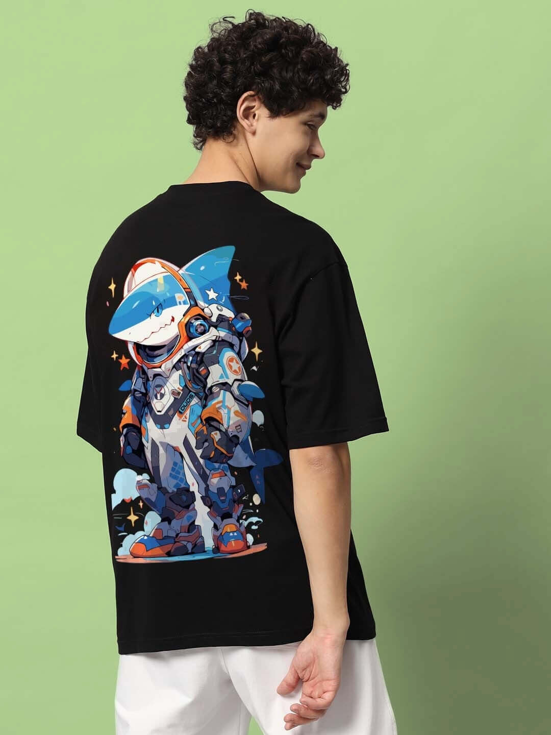 Person wearing ROBO SHARK OVER-SIZED T-SHIRT BLACK with graphic design on back.