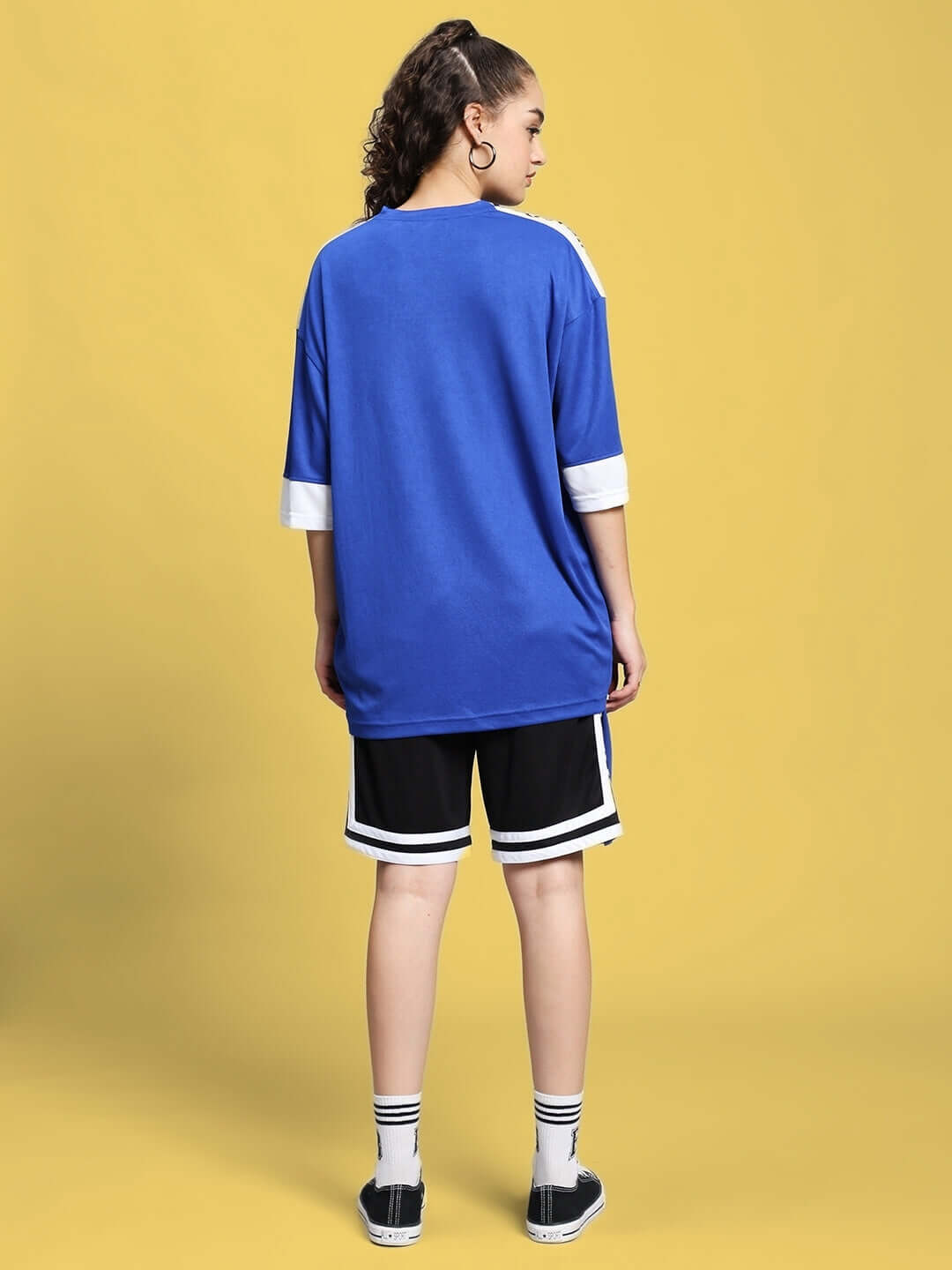 Back view of woman wearing royal blue colorblock co-ord set, featuring sports polyester fabric, styled for comfort.