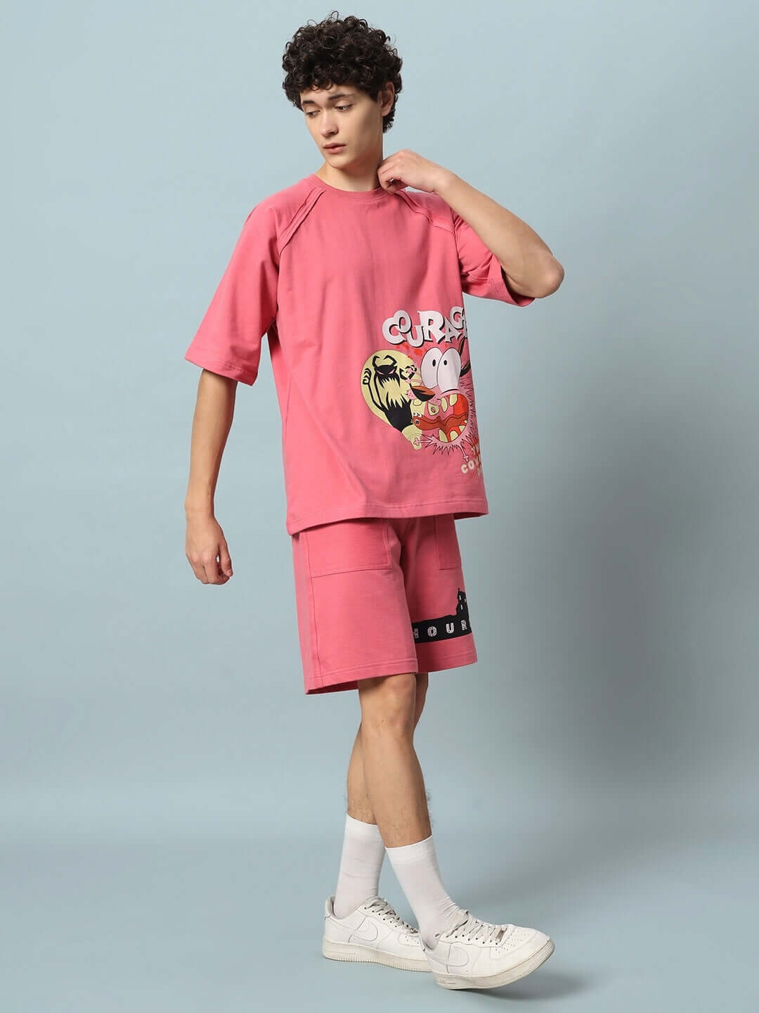 Man wearing COURAGE PRINT COTTON CO-ORD SET PINK with cartoon graphic. Premium Heavy Gauge Fabric.