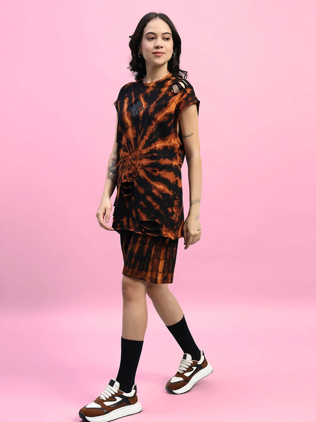 Women's Muscle Tee Ripped Tie-Dye Co-ord Set in Black, showcasing premium cotton fabric and unique design against a pink background.