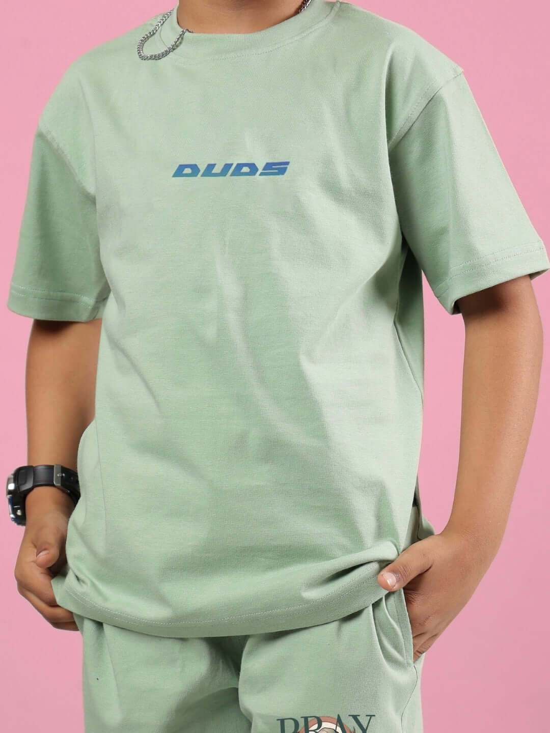 Nyanza Green Pray & Peace T-shirt for boys and girls, model wearing DUDS brand shirt with custom fit option, perfect for casual wear.