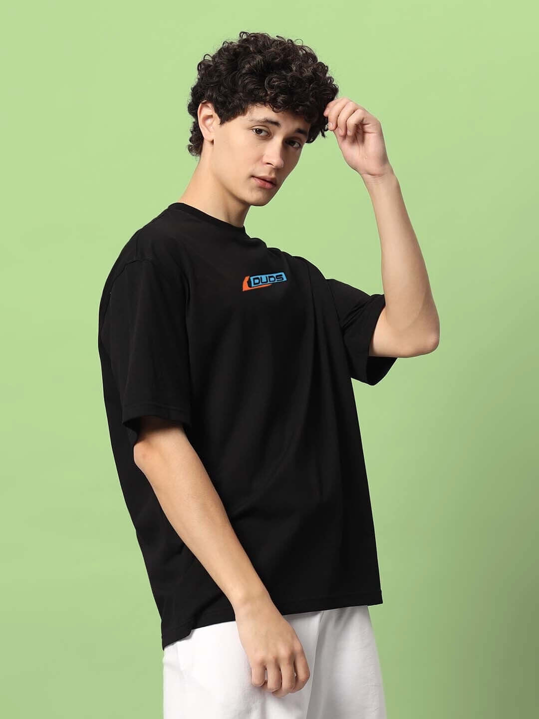 ROBO SHARK OVER-SIZED T-SHIRT BLACK, premium cotton fabric, modeled on male against green background.