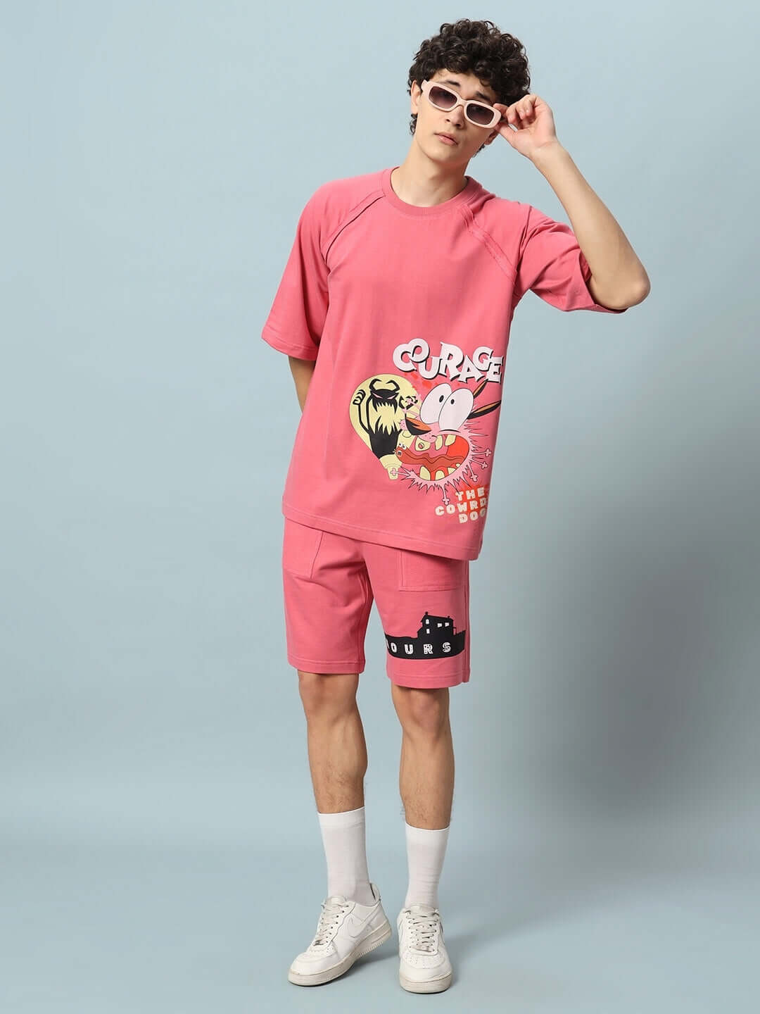 Man wearing COURAGE PRINT COTTON CO-ORD SET PINK, featuring premium heavy gauge fabric with a bold design. Ideal for casual fashion enthusiasts.