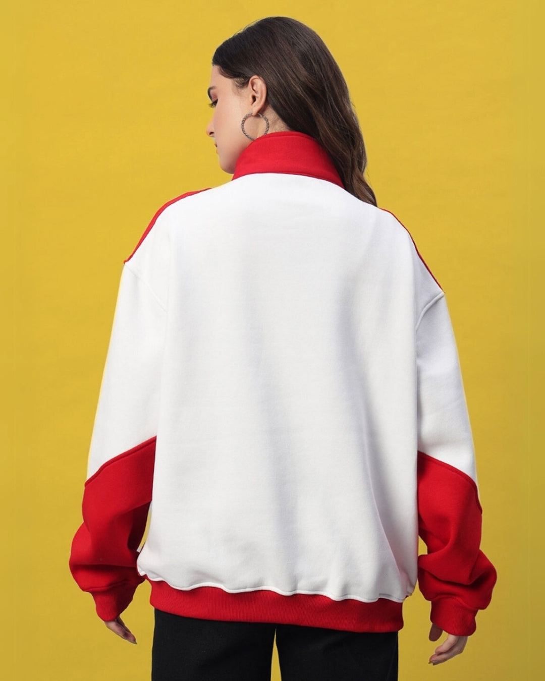 Rear view of woman wearing a women's red colorblock jacket with relaxed fit and modern design.
