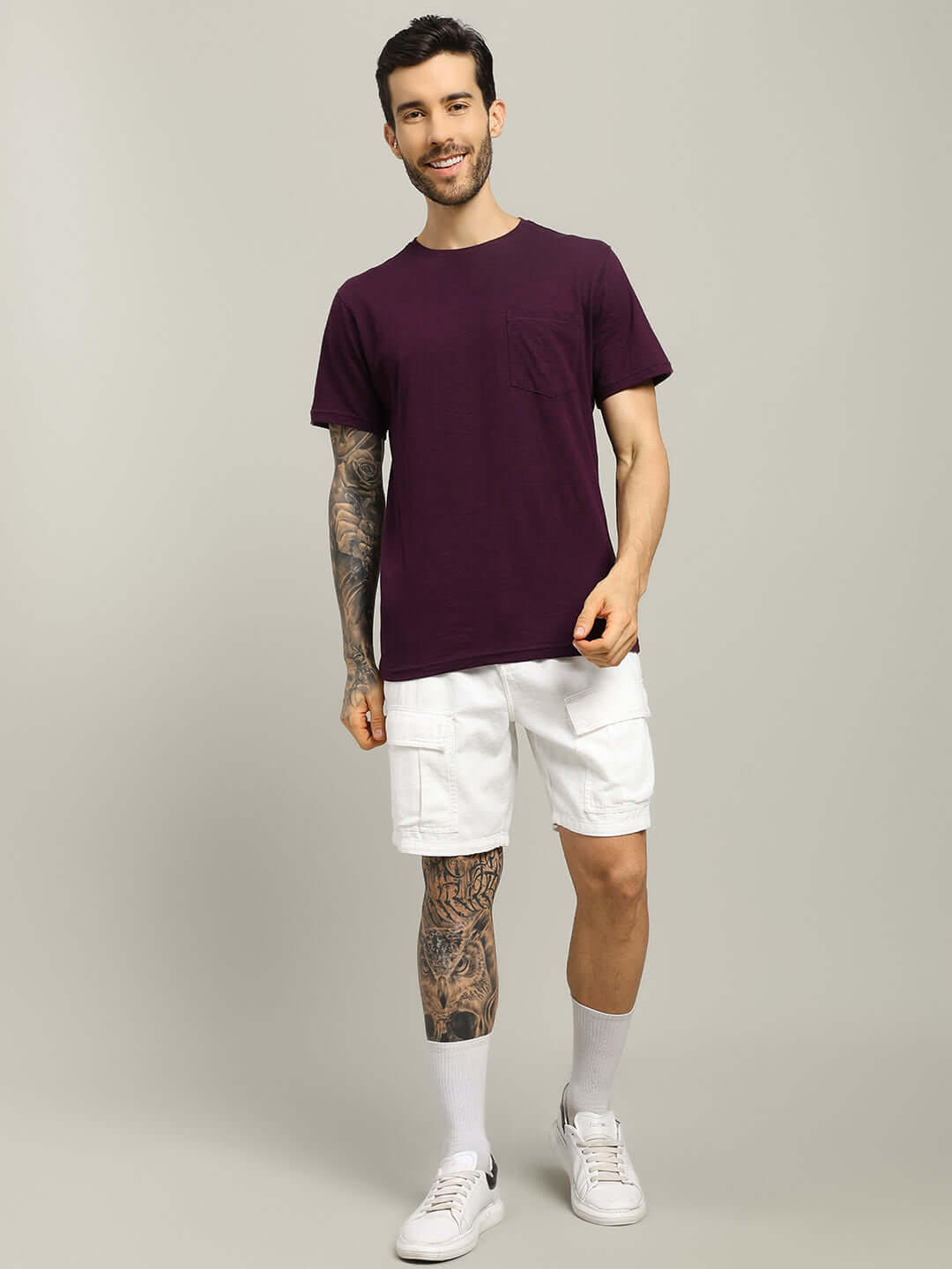 Joy Regular Fit T-Shirt in purple, crafted from premium heavy cotton slub fabric, worn by a model standing in white shorts.