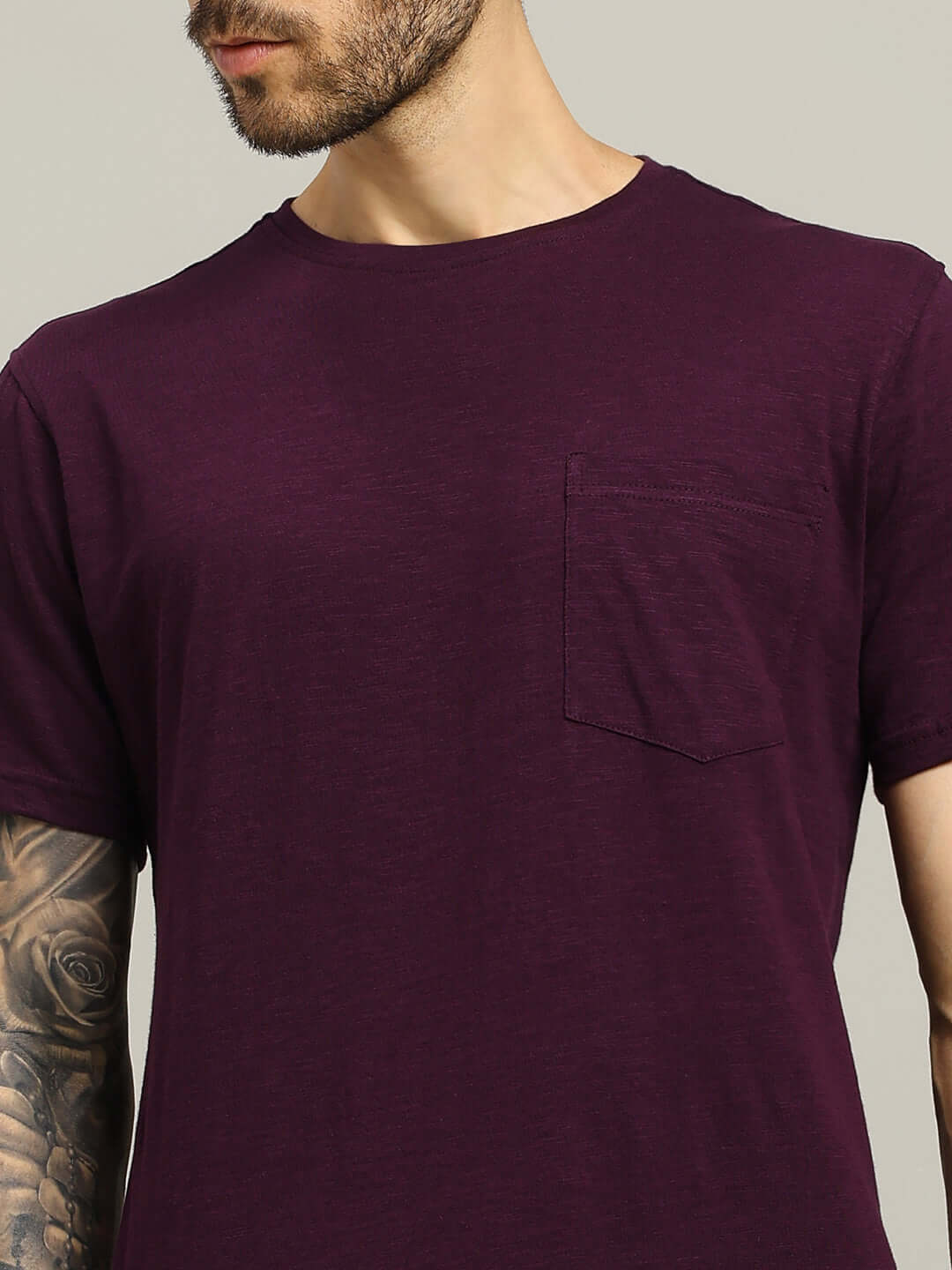 Model wearing JOY Regular Fit Purple T-Shirt, premium heavy cotton slub fabric, showcasing stylish design with pocket detail.