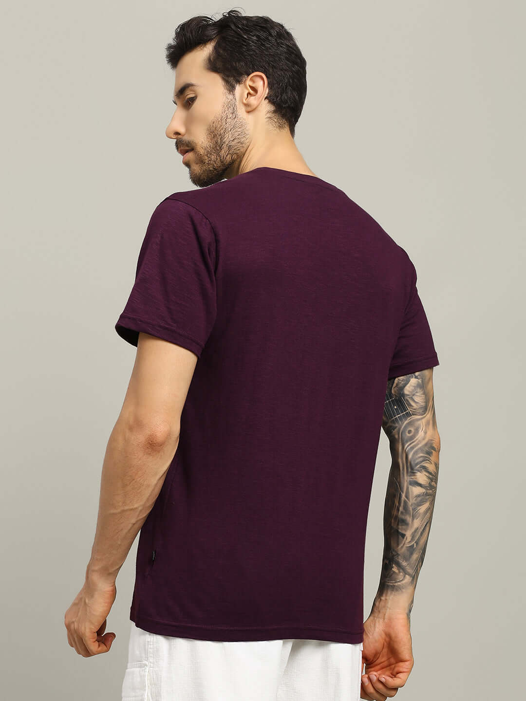 Back view of man wearing JOY Regular Fit T-Shirt in purple, premium heavy cotton slub, 100% bio-washed, made in India.