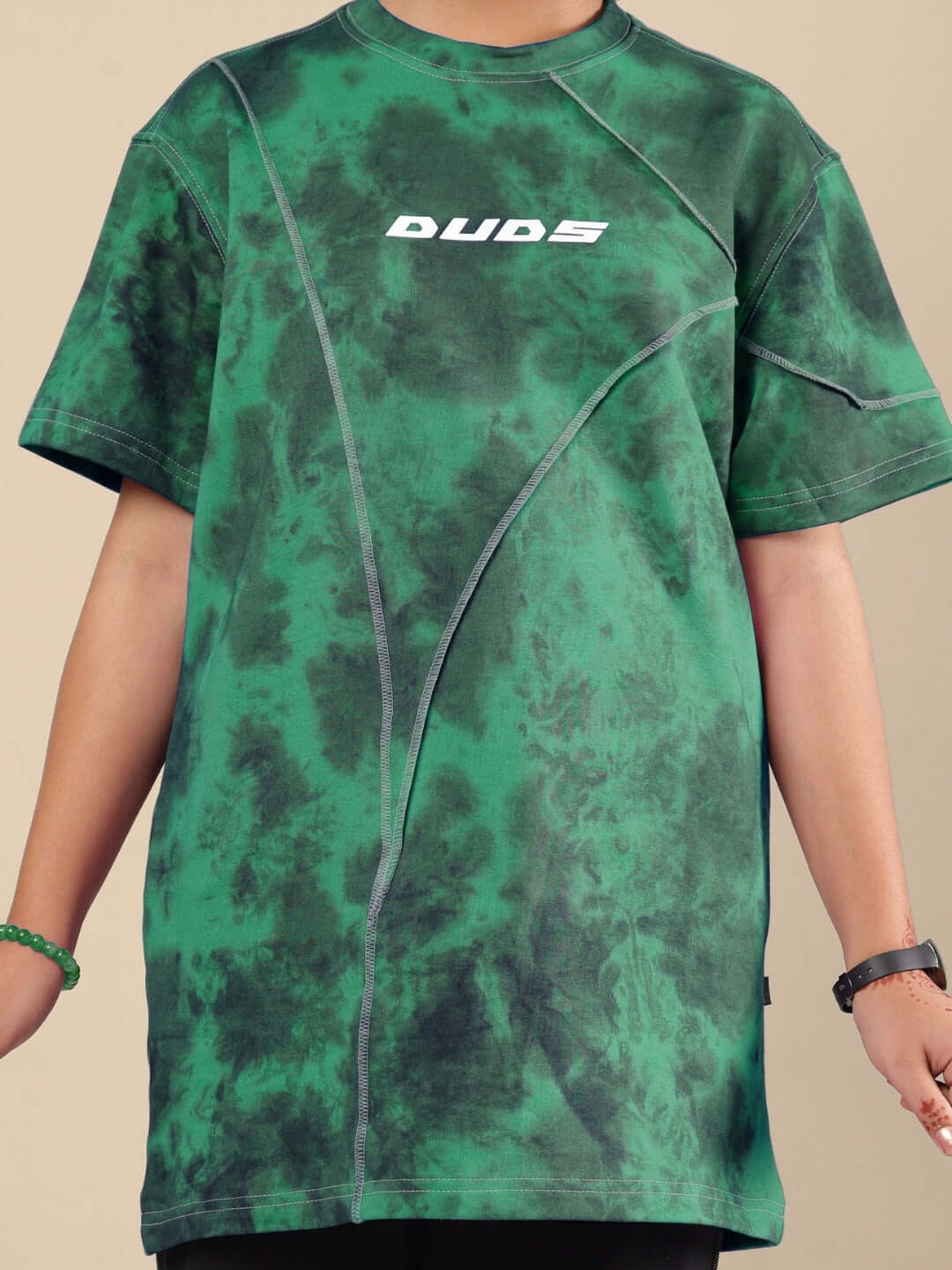 Green tie-dye t-shirt with front design logo, suitable for boys and girls, offered by DUDS.