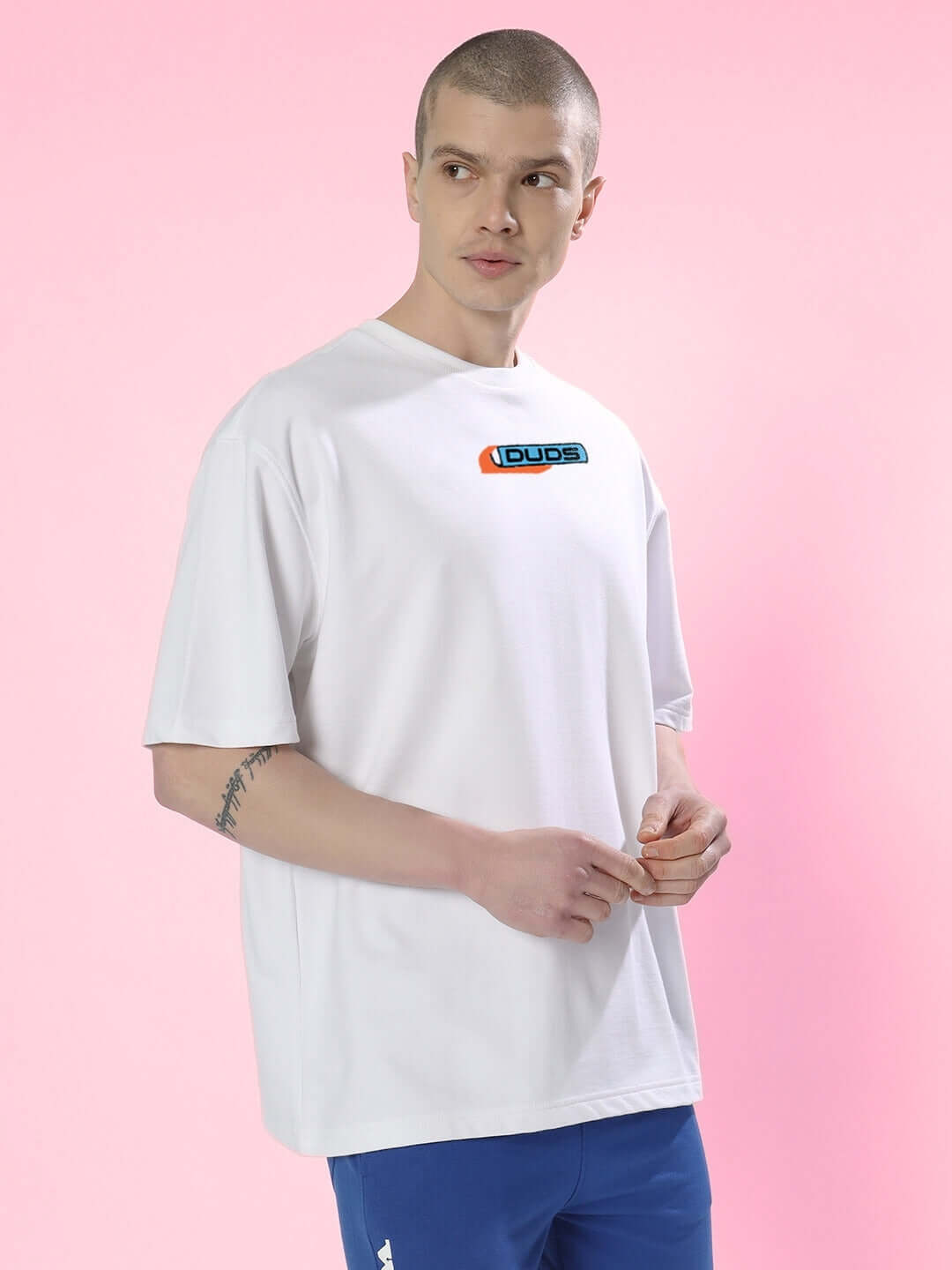 Model wearing ROBO SHARK OVER-SIZED T-SHIRT WHITE made of premium heavy gauge fabric, 97% cotton and 3% elastane.