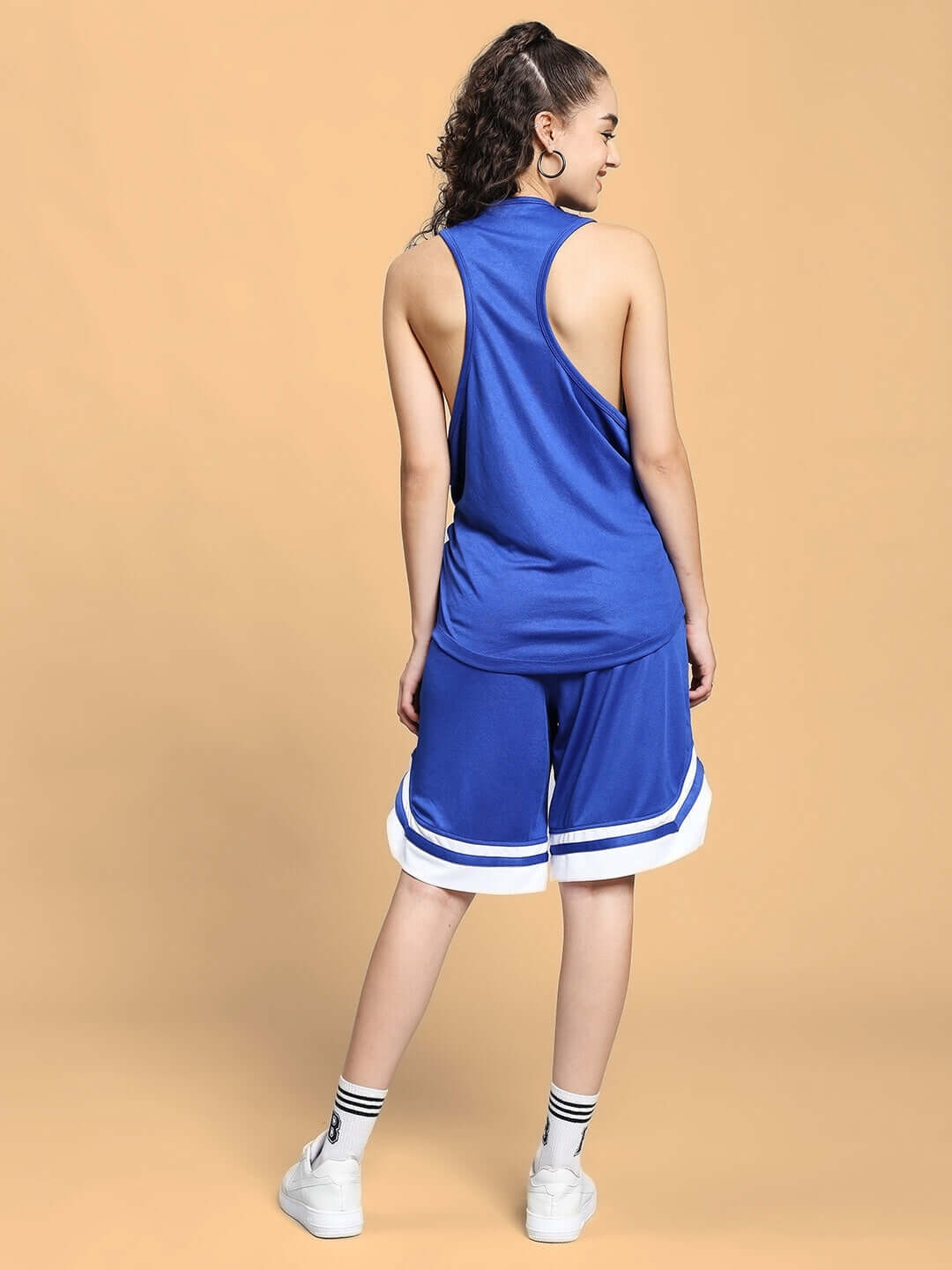 Back view of woman wearing Women's WD Wings Gym Co-ord Set in royal blue, made from sports polyester fabric.