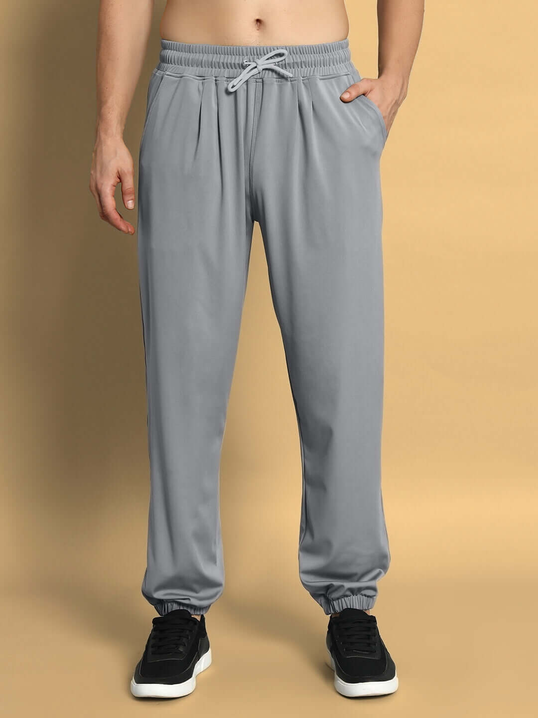 Model wearing grey AGILE RELAXED PANT JOGGER, showcasing comfortable fit and style, made with precision by DUDS.