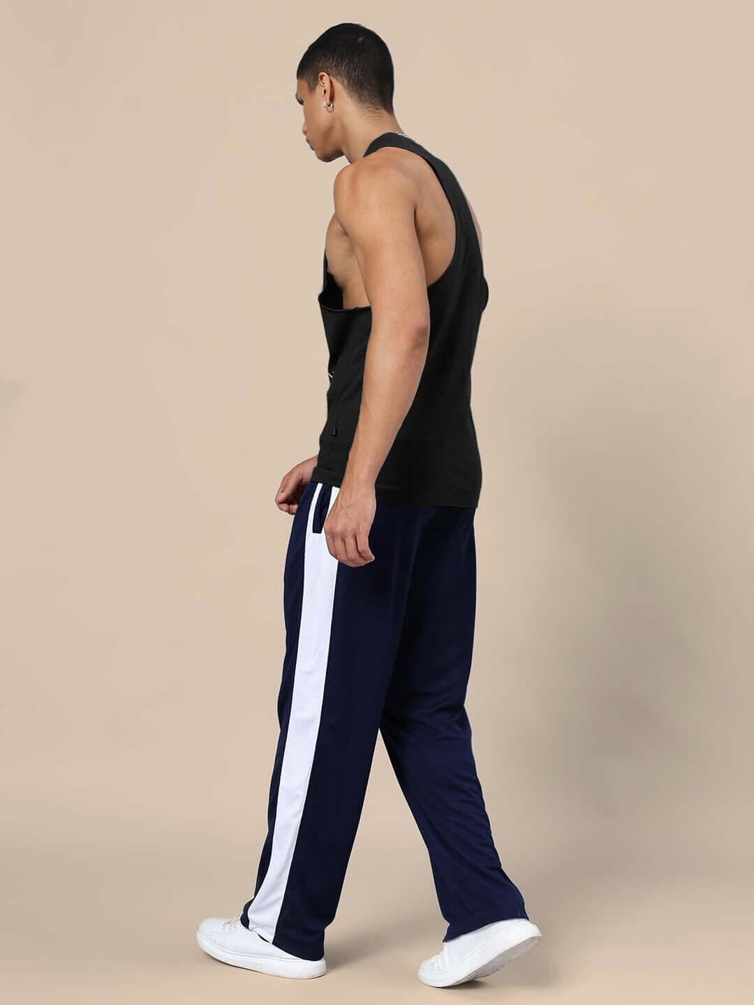 Model wearing DUDS KINGDOM Gym Co-Ord Set in black and navy-blue, showcasing unisex relaxed fit joggers with elasticated waistband.